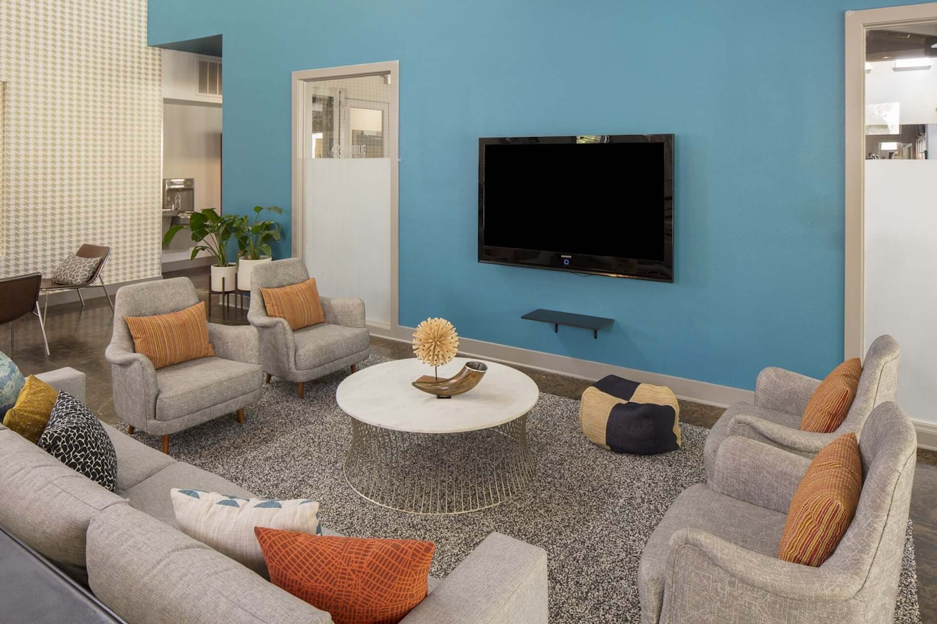 living room area with a couch and tv at republic at sam houston apartments